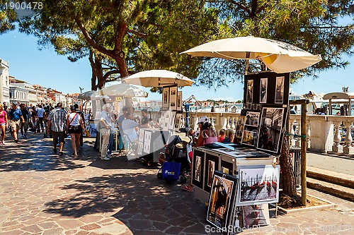 Image of 16. Jul 2012 - Street vendor selling tourist souvenirs. Most vendors in Venice aren't of Italian origin. 