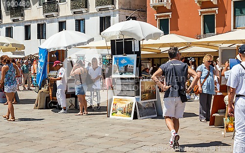 Image of 16. Jul 2012 - Street vendor selling tourist souvenirs. Most vendors in Venice aren't of Italian origin. 