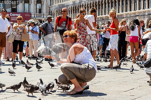 Image of 16. Jul 2012 - People with pigeons in San Marco Plaza 3 in Venice, Italy 