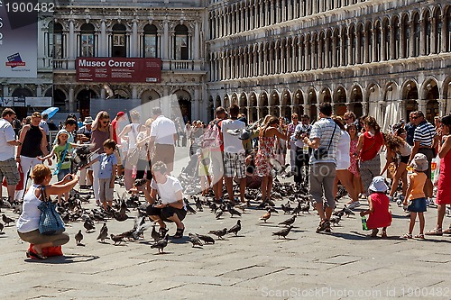 Image of 16. Jul 2012 - People with pigeons in San Marco Plaza 3 in Venice, Italy 