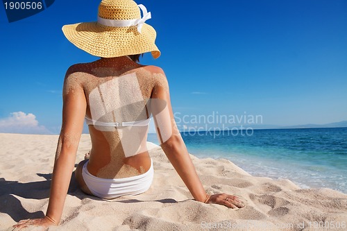 Image of pretty woman enjoying vacation on beach