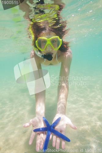 Image of Happy woman showing starfish