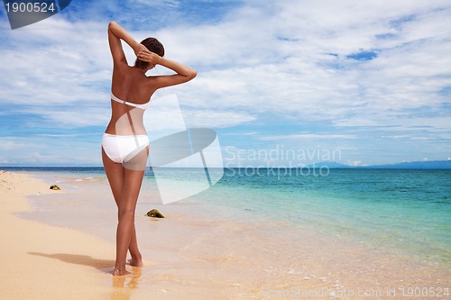 Image of Tanned woman on the beach