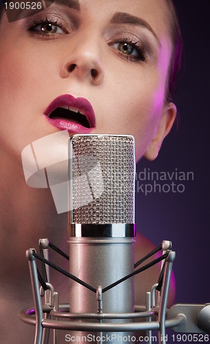 Image of pretty singer in the night club
