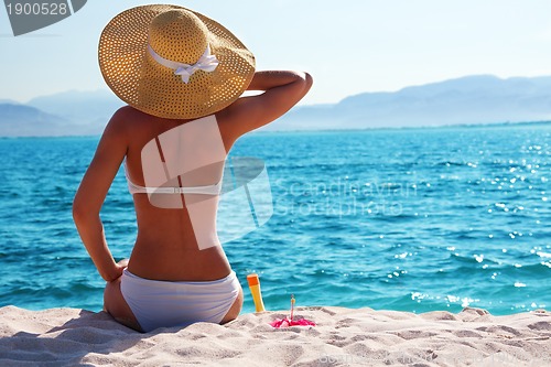 Image of woman resting on the beach