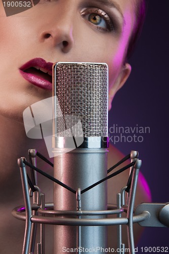 Image of beautiful woman singing