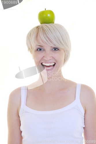 Image of happy  young  woman eat green apple isolated  on white