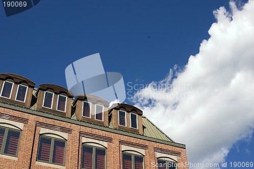 Image of Close up on a building with Clouds