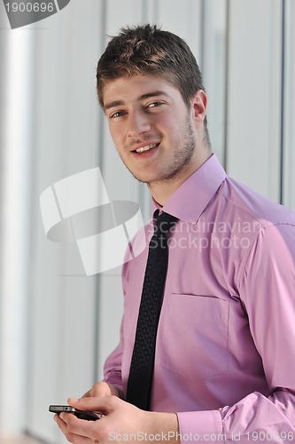 Image of young business man talk by cellphone