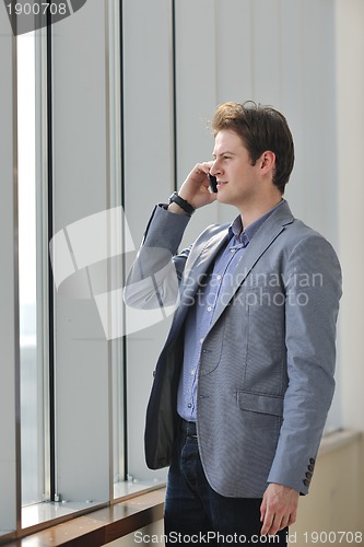 Image of young business man talk by cellphone