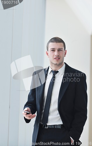 Image of young business man talk by cellphone