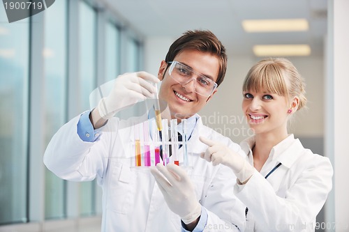 Image of science people in bright lab