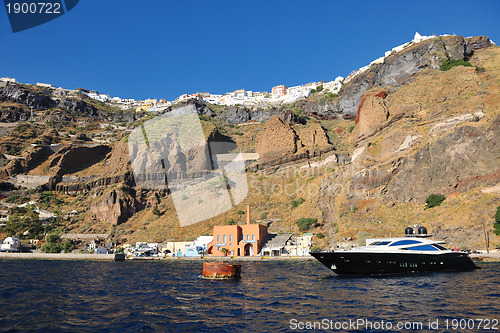 Image of santorini island coast with luxury yacht