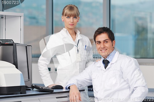 Image of science people in bright lab