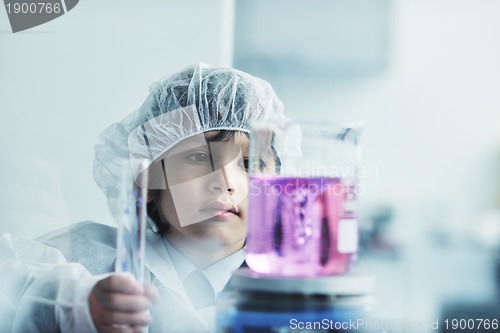 Image of little child scientist in lab