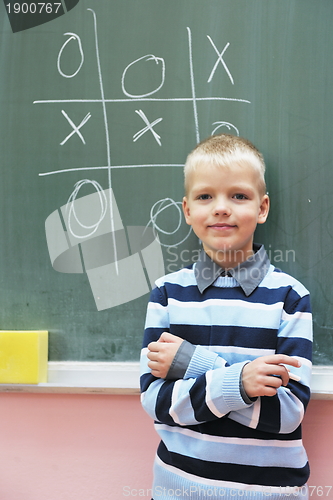 Image of happy young boy at first grade math classes 