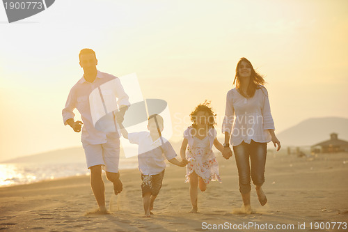 Image of happy young family have fun on beach