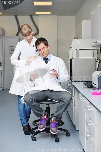 Image of science people in bright lab