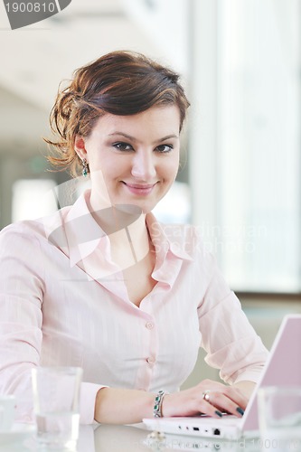 Image of young business woman on meeting