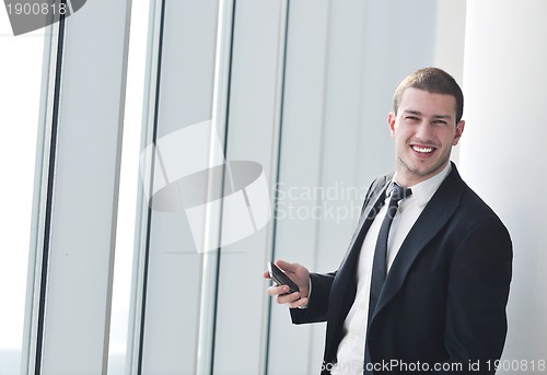 Image of young business man talk by cellphone