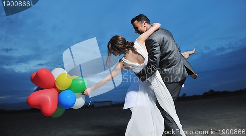 Image of romantic beach wedding at sunset