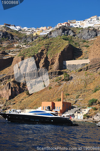 Image of santorini island coast with luxury yacht