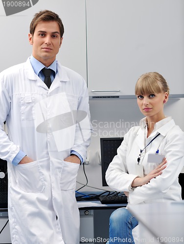 Image of science people in bright lab