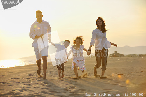 Image of happy young family have fun on beach