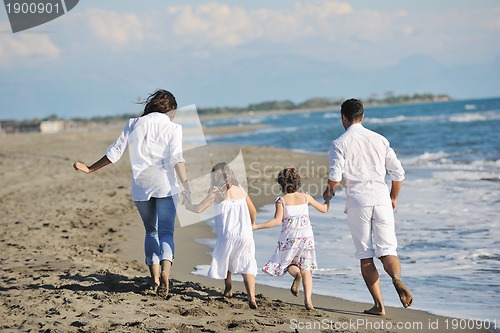 Image of happy young  family have fun on beach