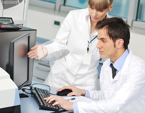 Image of science people in bright lab