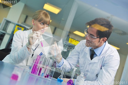 Image of science people in bright lab