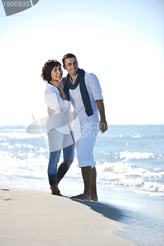 Image of happy young couple have fun at beautiful beach