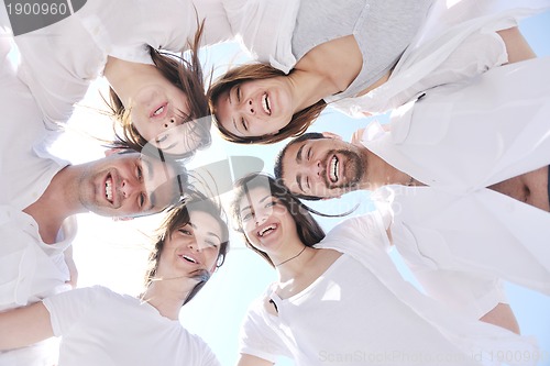 Image of Group of happy young people in have fun at beach