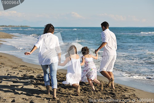 Image of happy young  family have fun on beach
