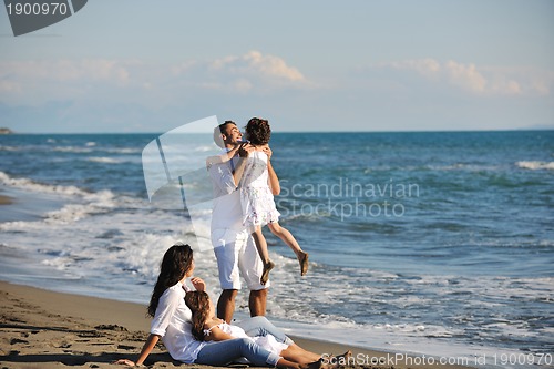 Image of happy young  family have fun on beach