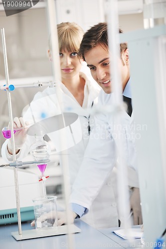 Image of science people in bright lab