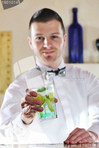 Image of pro barman prepare coctail drink on party