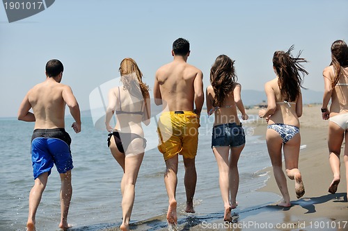 Image of happy young  people group have fun on beach