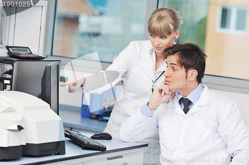 Image of science people in bright lab