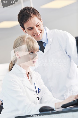 Image of science people in bright lab