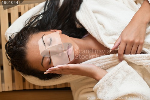 Image of Young woman take a steam bath