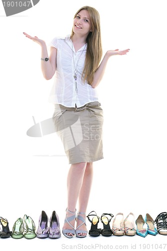 Image of pretty young woman with buying shoes addiction, isolated on whit