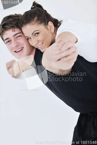 Image of happy young couple fitness workout and fun