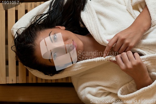 Image of Young woman take a steam bath