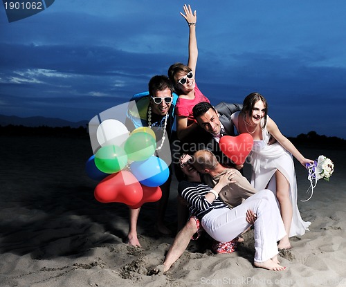 Image of happy young  people group have fun on beach