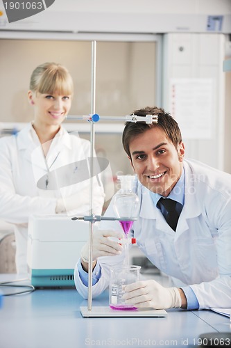 Image of science people in bright lab