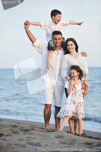 Image of happy young family have fun on beach