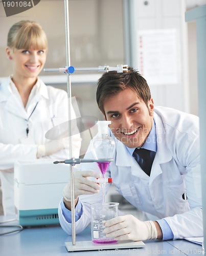 Image of science people in bright lab