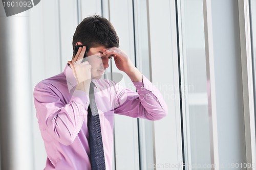 Image of young business man talk by cellphone