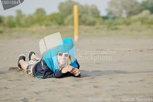 Image of man relax on beach